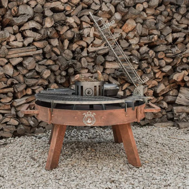 Grill with pile of wood background