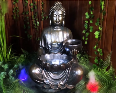 Tranquil sitting Buddha with bowl water feature fountain Water flow