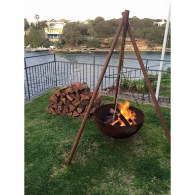 Tripod CastIron Fire Pit in the backyard