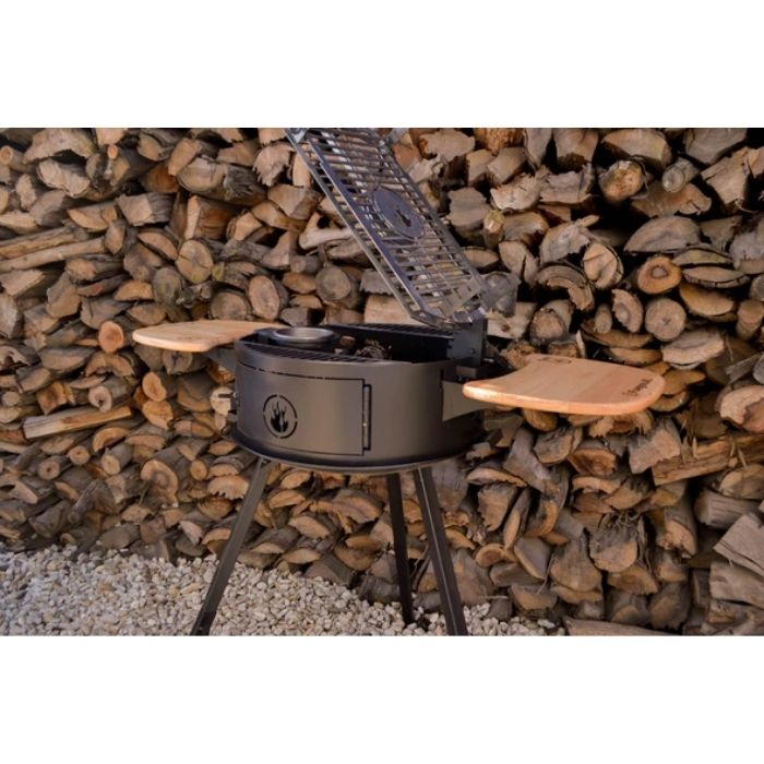 BBQ Grills with pile of woods in the background