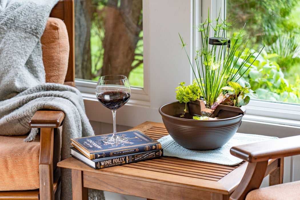 AquaGarden Tabletop Fountain is on the coffee table