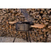 Argentine BBQ Grill with the pile of wood background