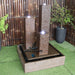 Atlantis Balinese Style tower water feature rust wit plant