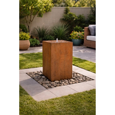 Corten Steel Bermuda Bubbling Fountain in the patio with stone