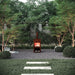 Corten Steel Fire Pit – The Spire sits on the patio area