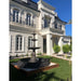 Heron Cast Iron 3 Tier Fountain sits in front of patio