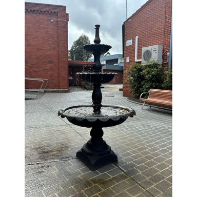 Lisbon Cast Iron 3 Tier Water Feature Fountain standing in front of the building