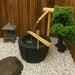 Mizubachi Shishi Odoshi Japanese Bowl Water Feature in the garden