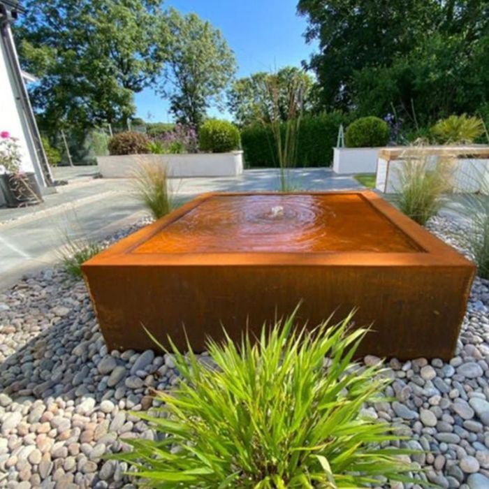 Rustic Corten Steel Cube fountain with some rocks