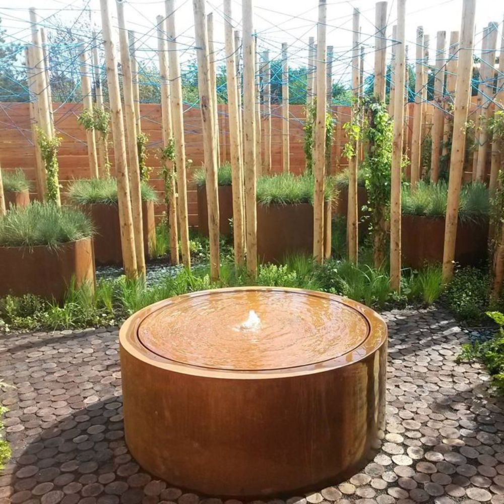 Rustic Corten Sttel Round Water Feature in the garden