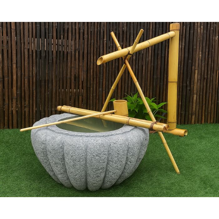 Tsukubai Shishi Odoshi Japanese Bowl Water Feature in the garden
