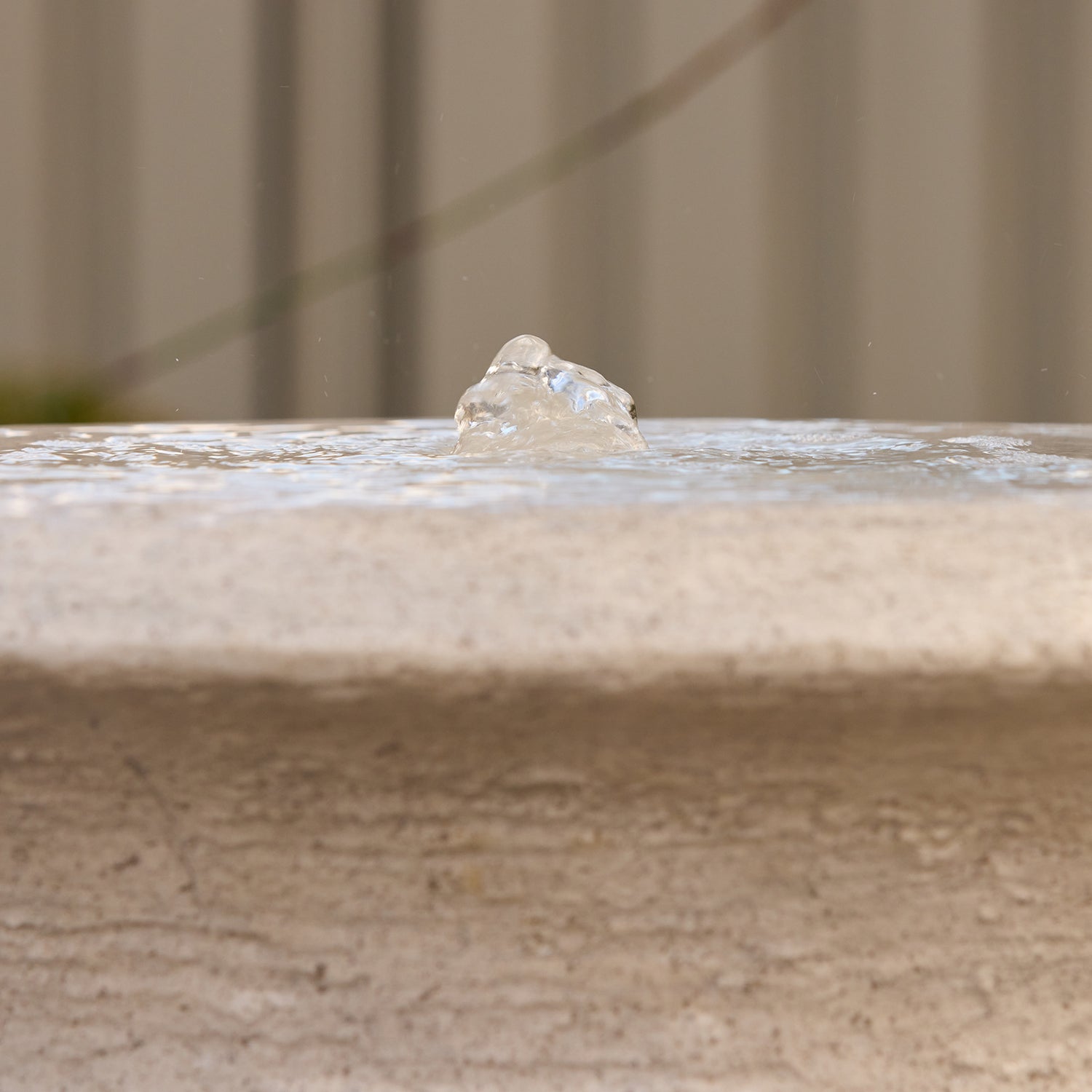 close view of bubbling water on the top