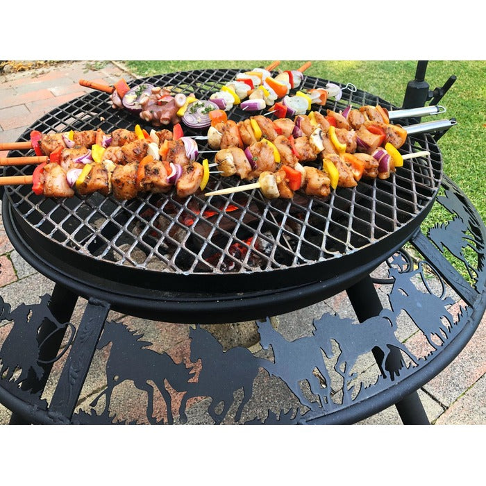 cooking meat skew on the bbq plate