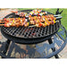 cooking meat skew on the bbq plate