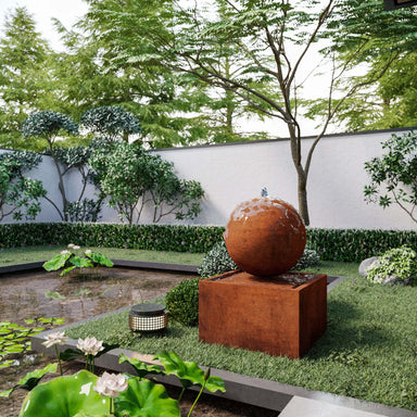 corten steel triton water feature in the garden
