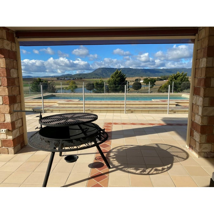 fire pit sits near the pool
