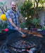 man enjoys cooking bbq