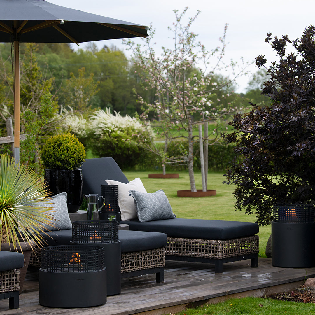 three different sizes of firepits in the outdoor area