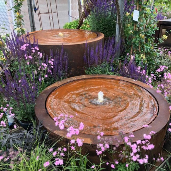 two Rustic Corten Steel Round Water Feature in the garden