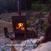warm night with Corten Steel Fire Pit – The Spire