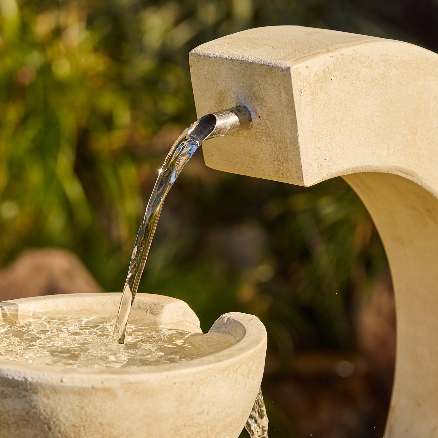 water is coming out from Crescent Twin Bowls Fountain