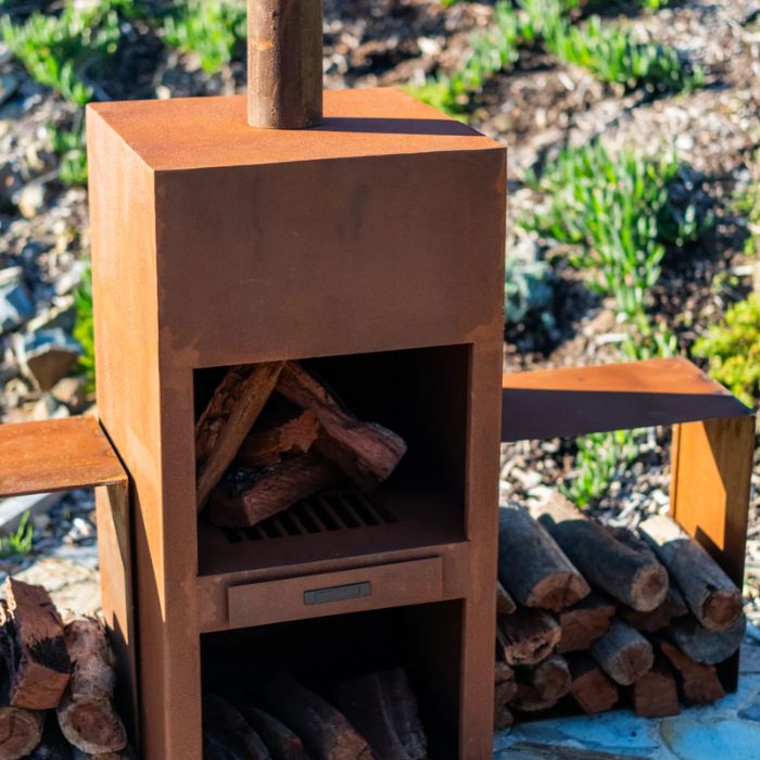 with fire wood and Corten Steel Fire Pit – The Spire