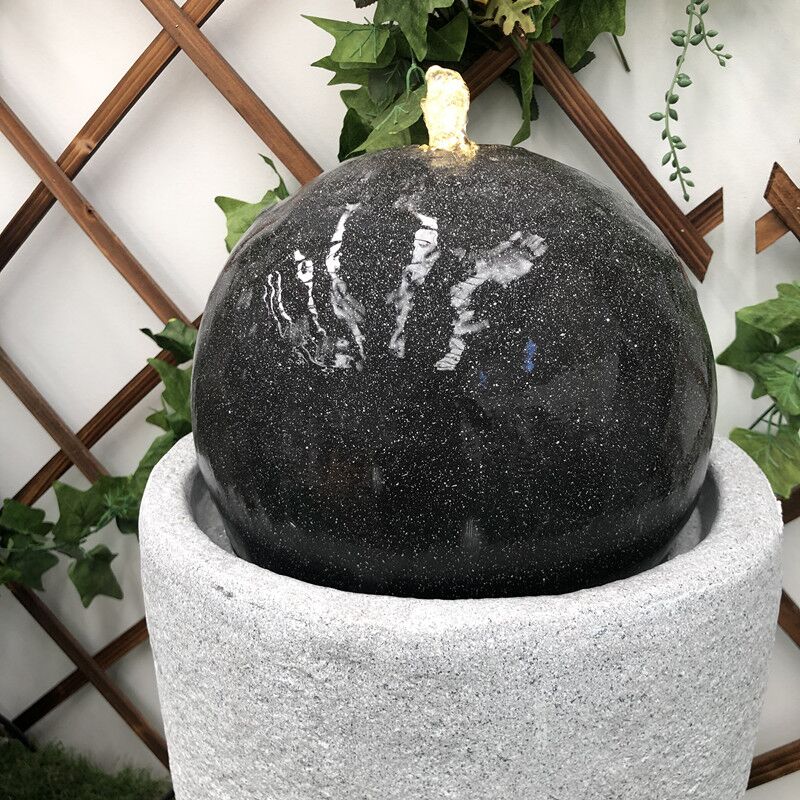 Black Ball Bubbling Vase Water Feature Close up
